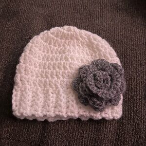 Homemade crochet baby hat with flower